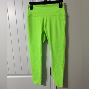 Neon green Fabletics leggings w/ pockets inside